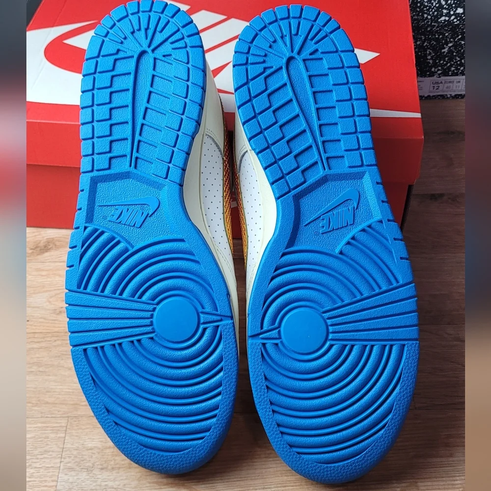 Nike White and Blue Sneakers with Orange Swoosh